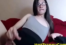 Cute nerdy tranny cums all over her lovely dress on webcam show